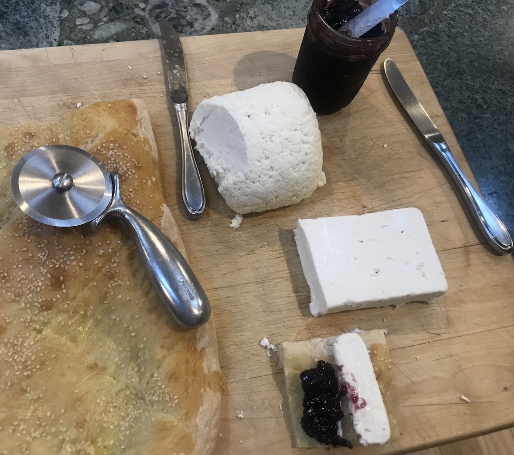 Cutting board with bread and cheese